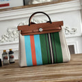 HERMES HERBAG ZIP 31 LAQUERED BAG IN GREEN MIX BLUE H PLUME CANVAS