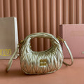 WANDER MATELASSÉ NAPPA MINI BAG 18 IN GOLDEN LAMBSKIN